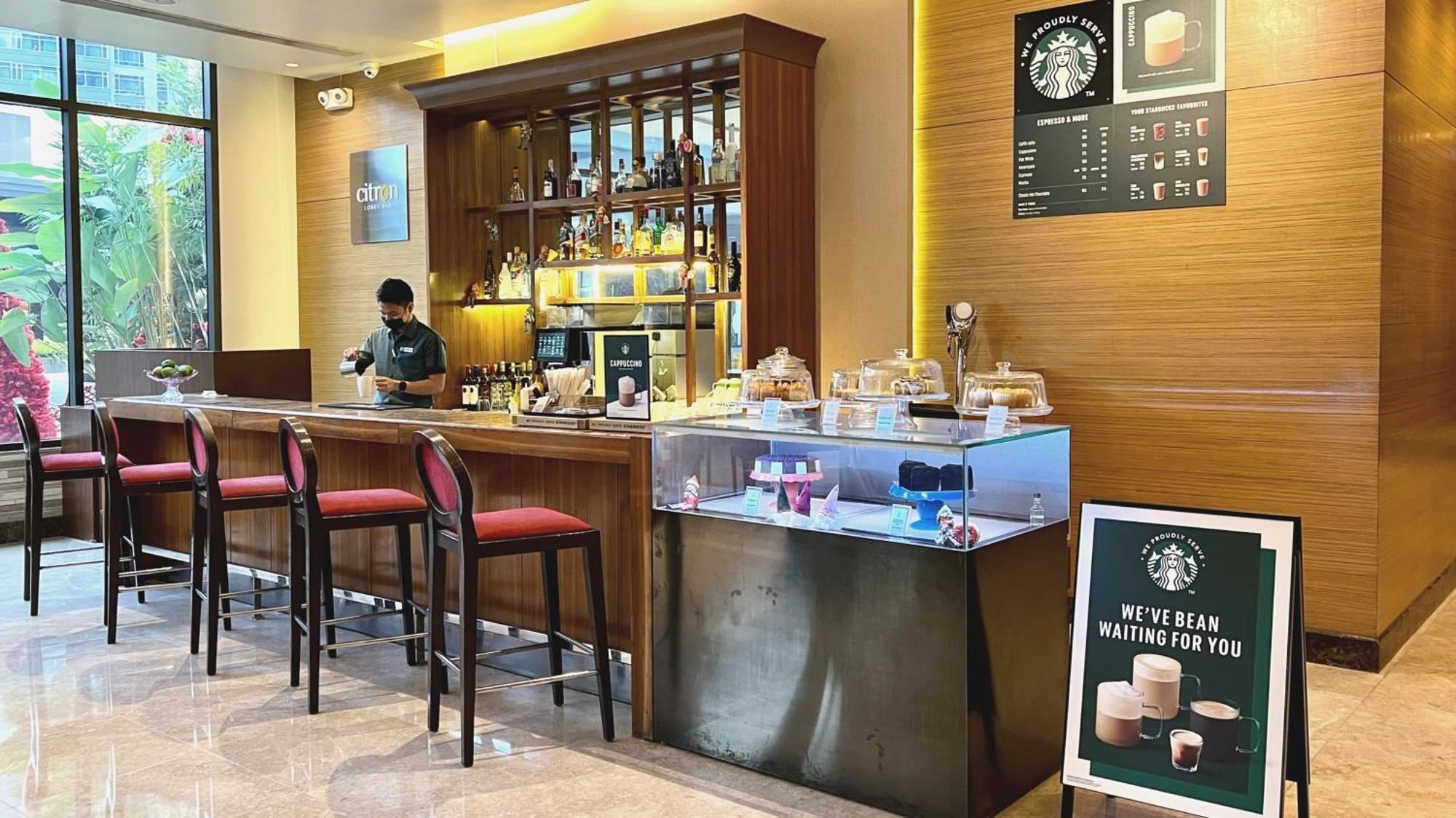 Holiday Inn & Suites Makati By Ihg Makati City Exterior photo Starbucks in Hong Kong